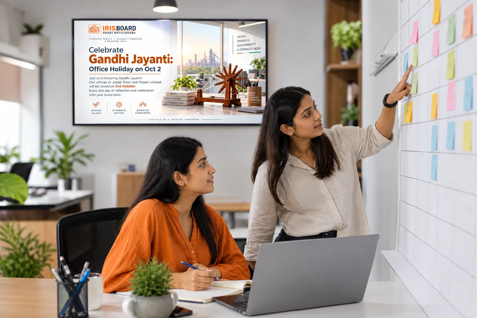 HR colleagues planning the year on a wall planner